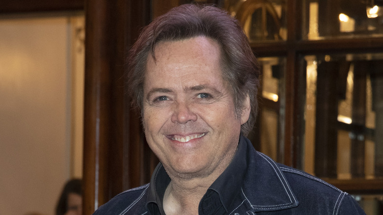 Jimmy Osmond smiles pose