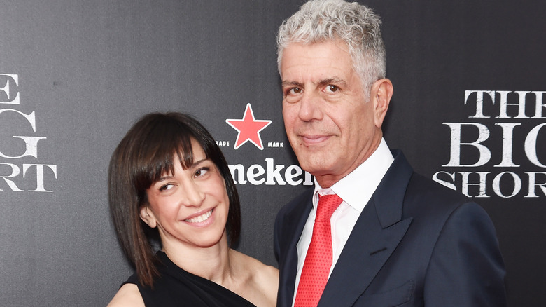 Ottavia Busia and Anthony Bourdain posing