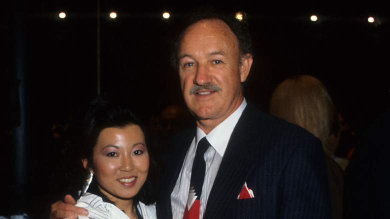 Betsy Arakawa and Gene Hackman, posing together at an event