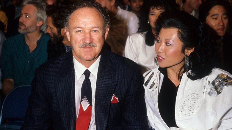 Gene Hackman and Betsy Arakawa, posing at an event