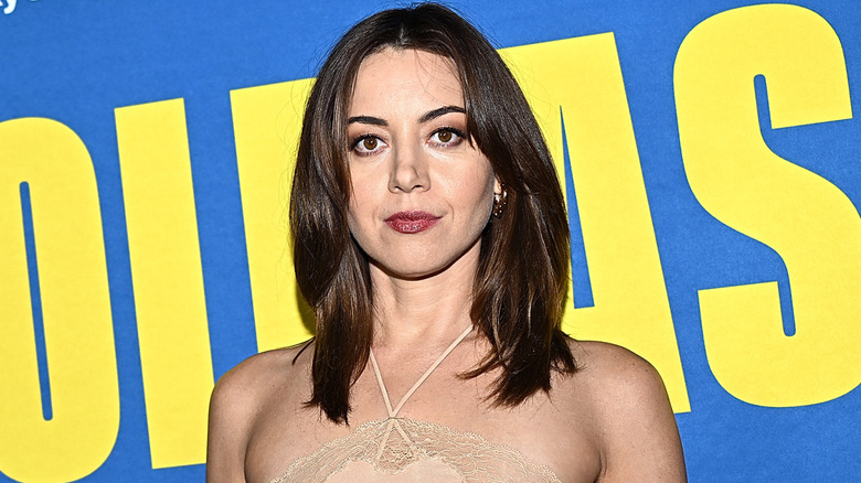 Aubrey Plaza wearing flesh-toned lace halter dress