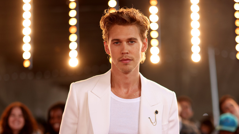 Austin Butler with lights behind him