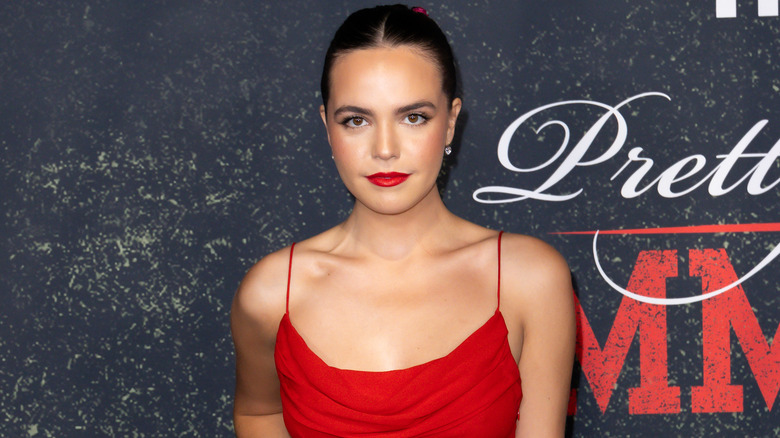 Bailee Madison in a red dress at an event