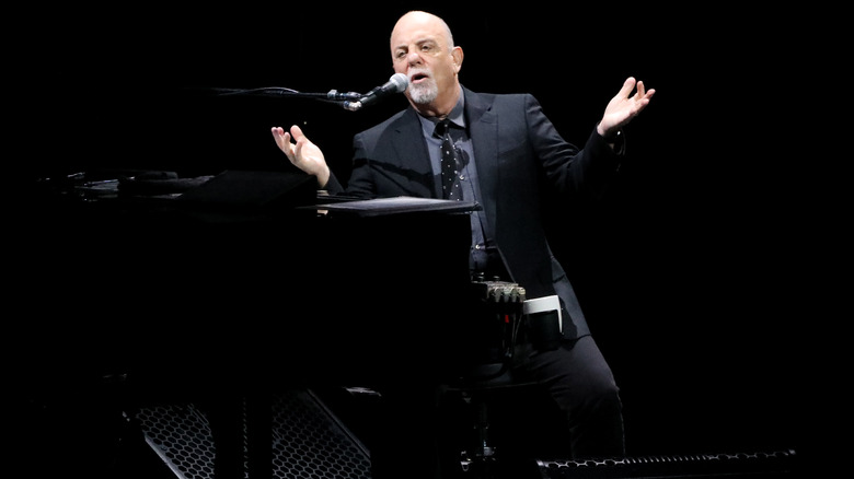 Billy Joel playing piano