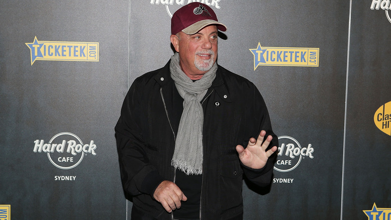 Billy Joel waving at red carpet event