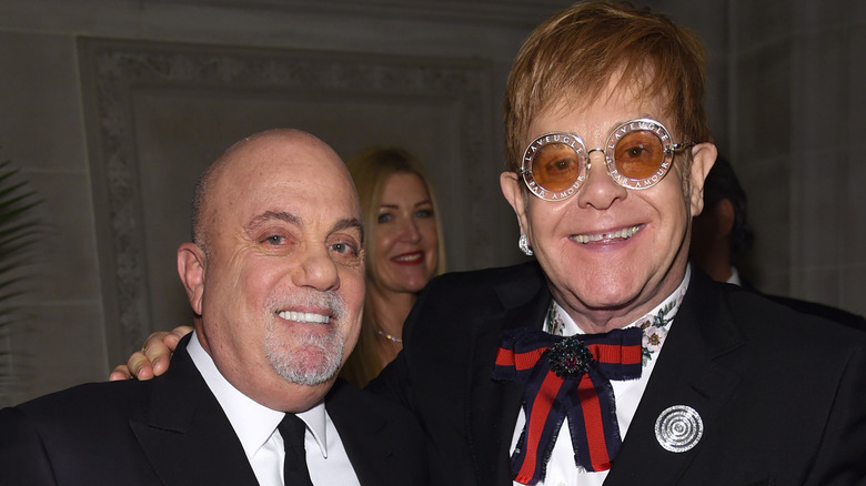 Billy Joel and Elton John smiling together