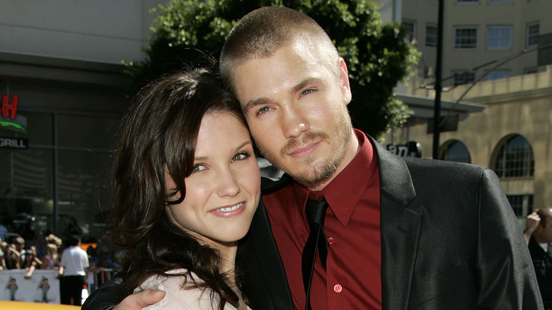 Chad Michael Murray resting head on Sophia Bush