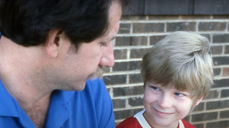 Dale Earnhardt Jr.smiling at father