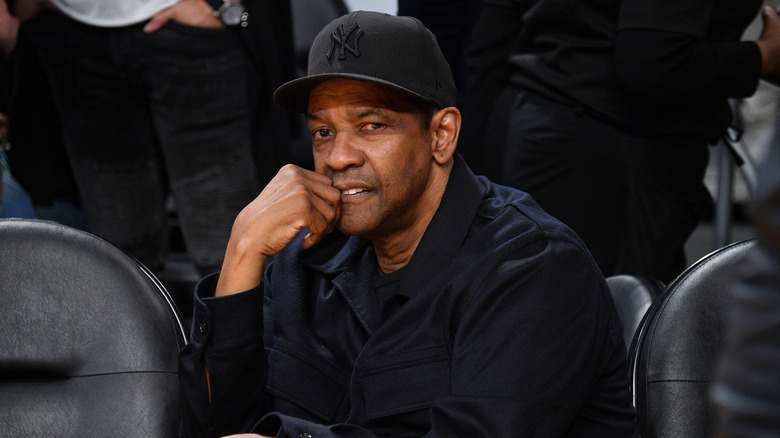 Denzel Washington wearing a baseball cap