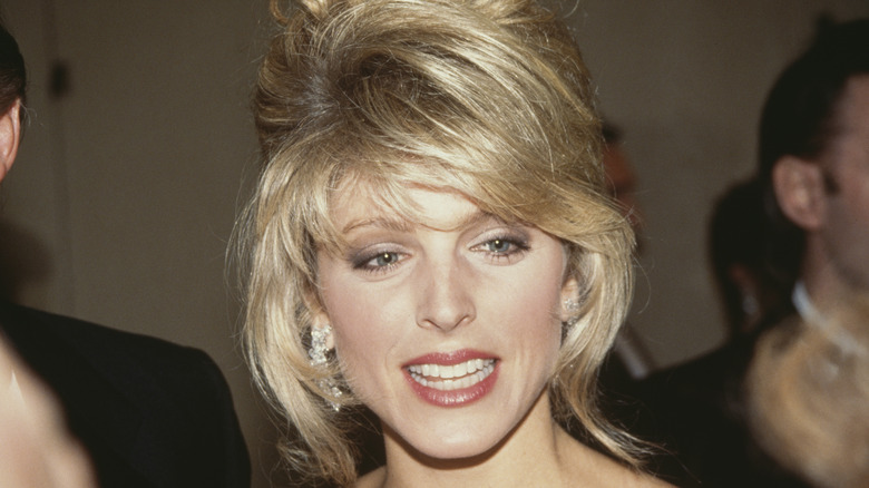 Marla Maples updo hair smiling