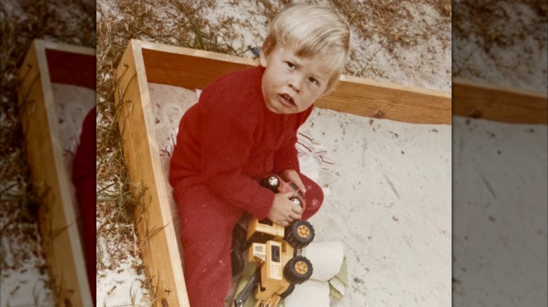 A 3-year-old Elon plays with toys