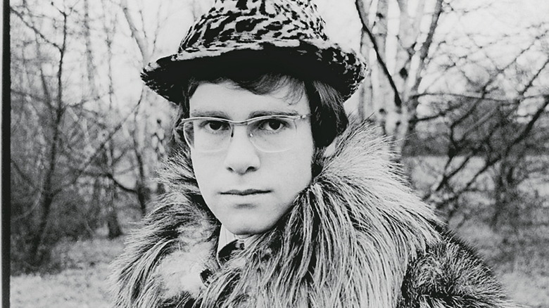 Elton John posing in a hat in 1968