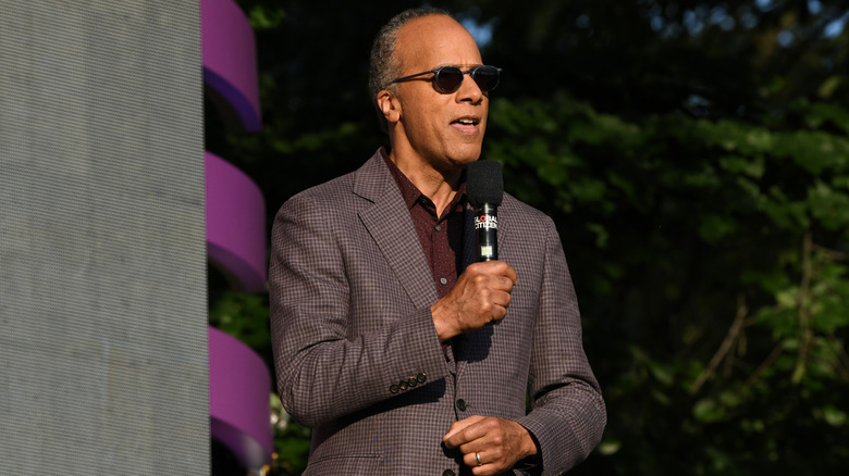 Lester Holt on stage at a Global Citizen concert.