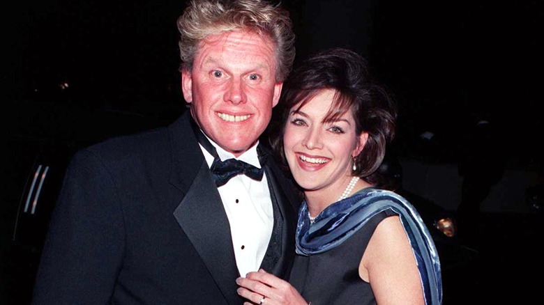 Gary Busey and Tiani Warden smiling in formalwear