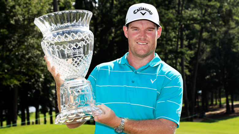 Grayson Murray holding trophy