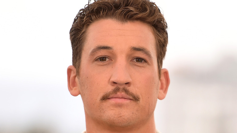 Miles Teller poses