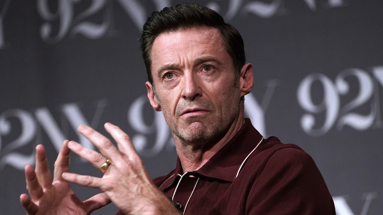 Hugh Jackman wearing a burgundy shirt