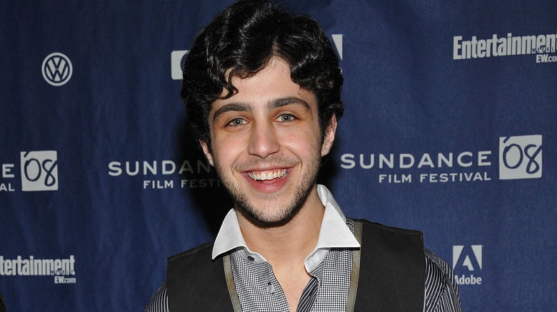 A young Josh Peck smiling at an event