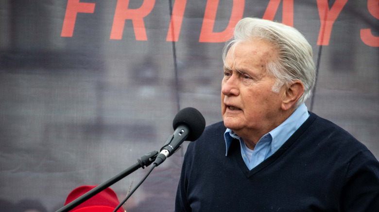 Martin Sheen speaks into microphone