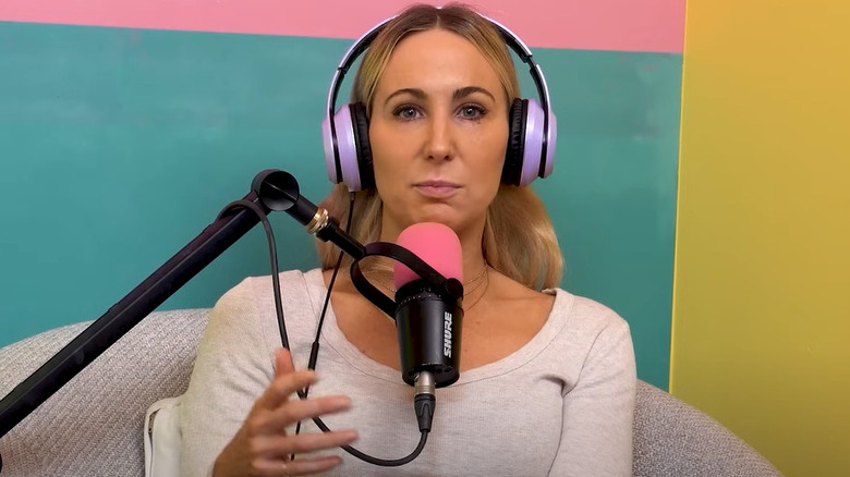 Nikki Glaser wearing headphones