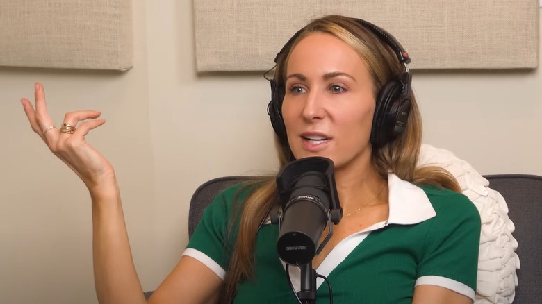 Nikki Glaser speaking into microphone