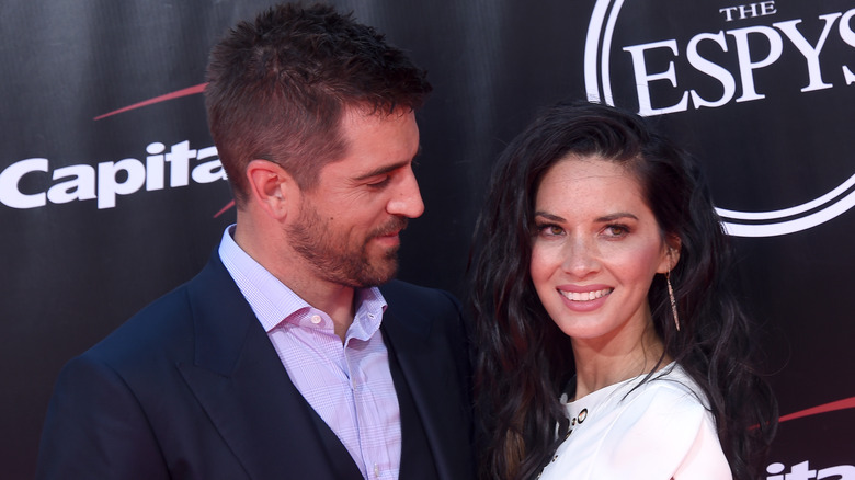 Olivia Munn and Aaron Rodgers, both smiling