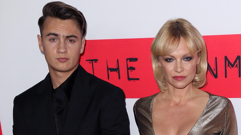 Brandon Thomas Lee poses with Pamela Anderson in 2015