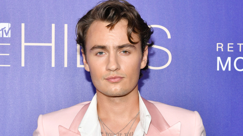 Brandon Thomas Lee poses in a pink suit