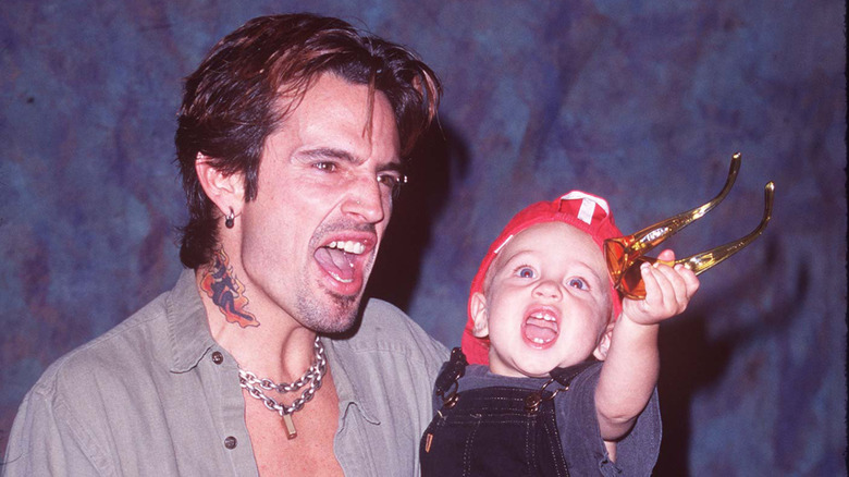 Tommy Lee holds a young Brandon in the '90s