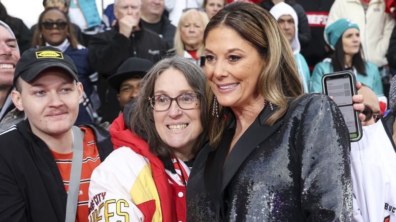 Randi Mahomes posing with fans