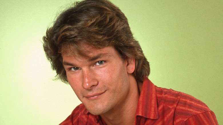 Patrick Swayze smirking at the camera