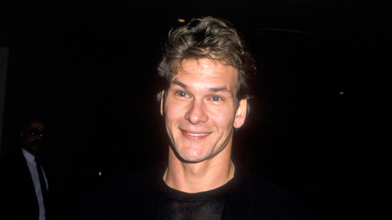 Patrick Swayze posing at an event