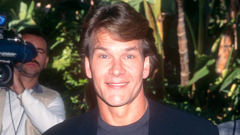 Patrick Swayze posing at an event