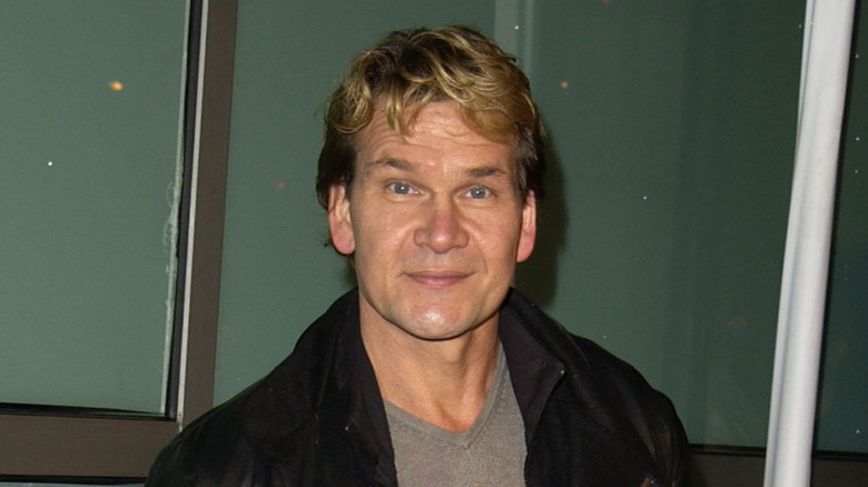 Patrick Swayze posing at an event