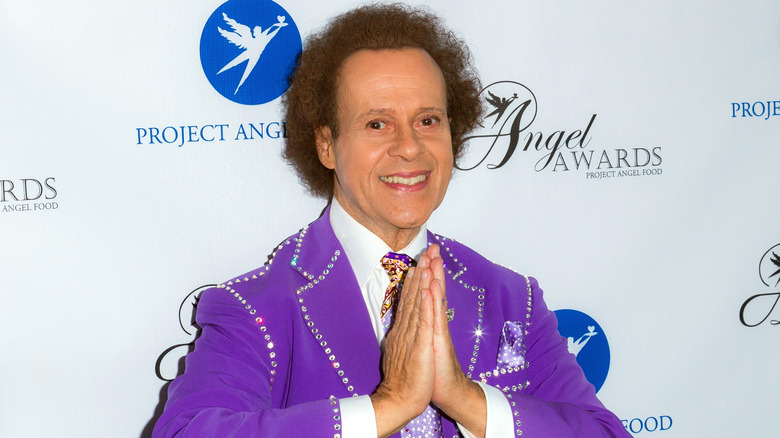 Richard Simmons smiling hands praying