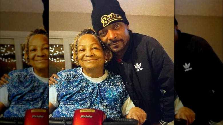 Snoop Dogg with arm around Beverly Tate
