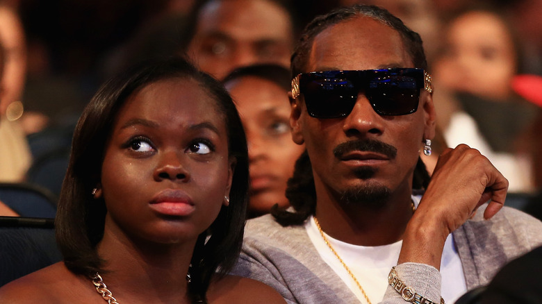 Cori Broadus looking up, Snoop Dogg wearing shades