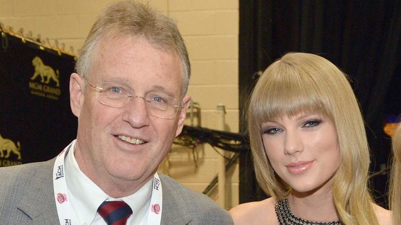 Scott and Taylor Swift pose together