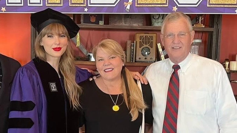 Taylor, Andrea, and Scott Swift posing