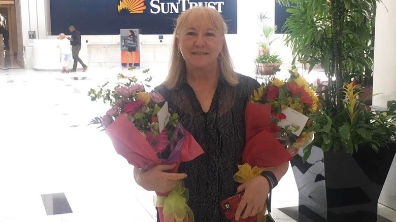 Donna Kelce holding flowers