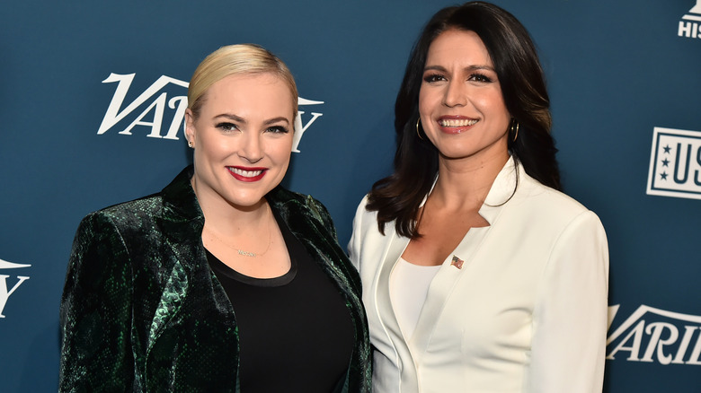 Tulsi Gabbard and Meghan McCain posing together.