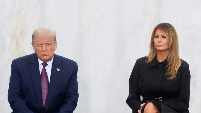 Donald Trump and Melania Trump seated at event