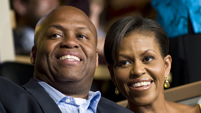 Craig Robinson and Michelle Obama smile