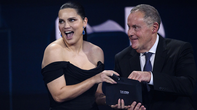 Adriana Lima and Andres Cantor on stage