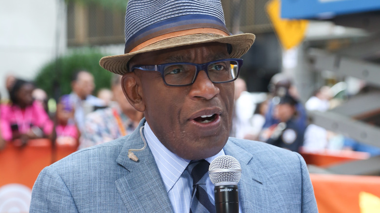 Al Roker reporting in a hat