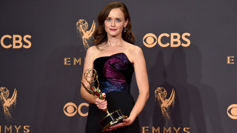 Alexis Bledel posing with Emmy