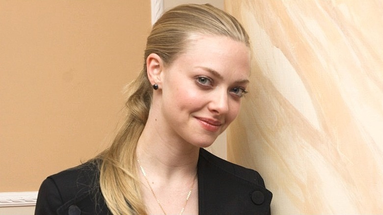 Amanda Seyfried looking to side and smiling