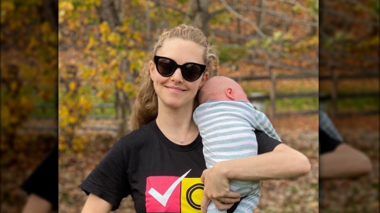 Amanda Seyfried holding baby