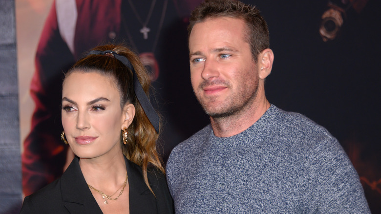 Armie Hammer and Elizabeth Chambers posing 