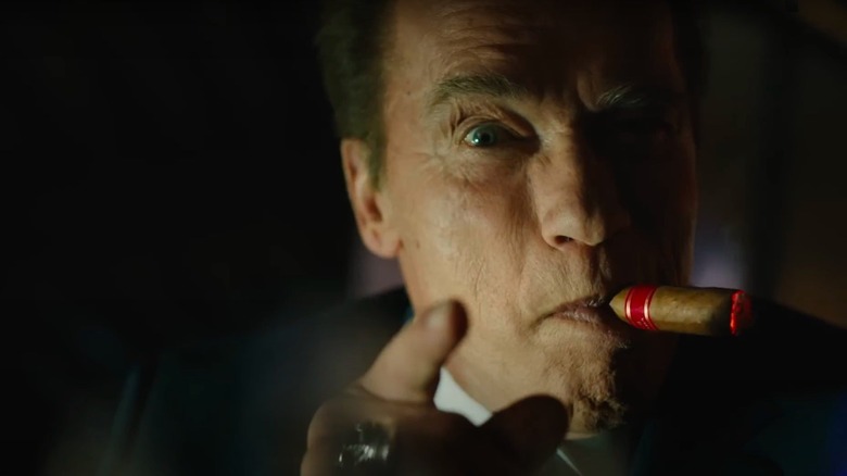 Arnold Schwarzenegger smoking a cigar